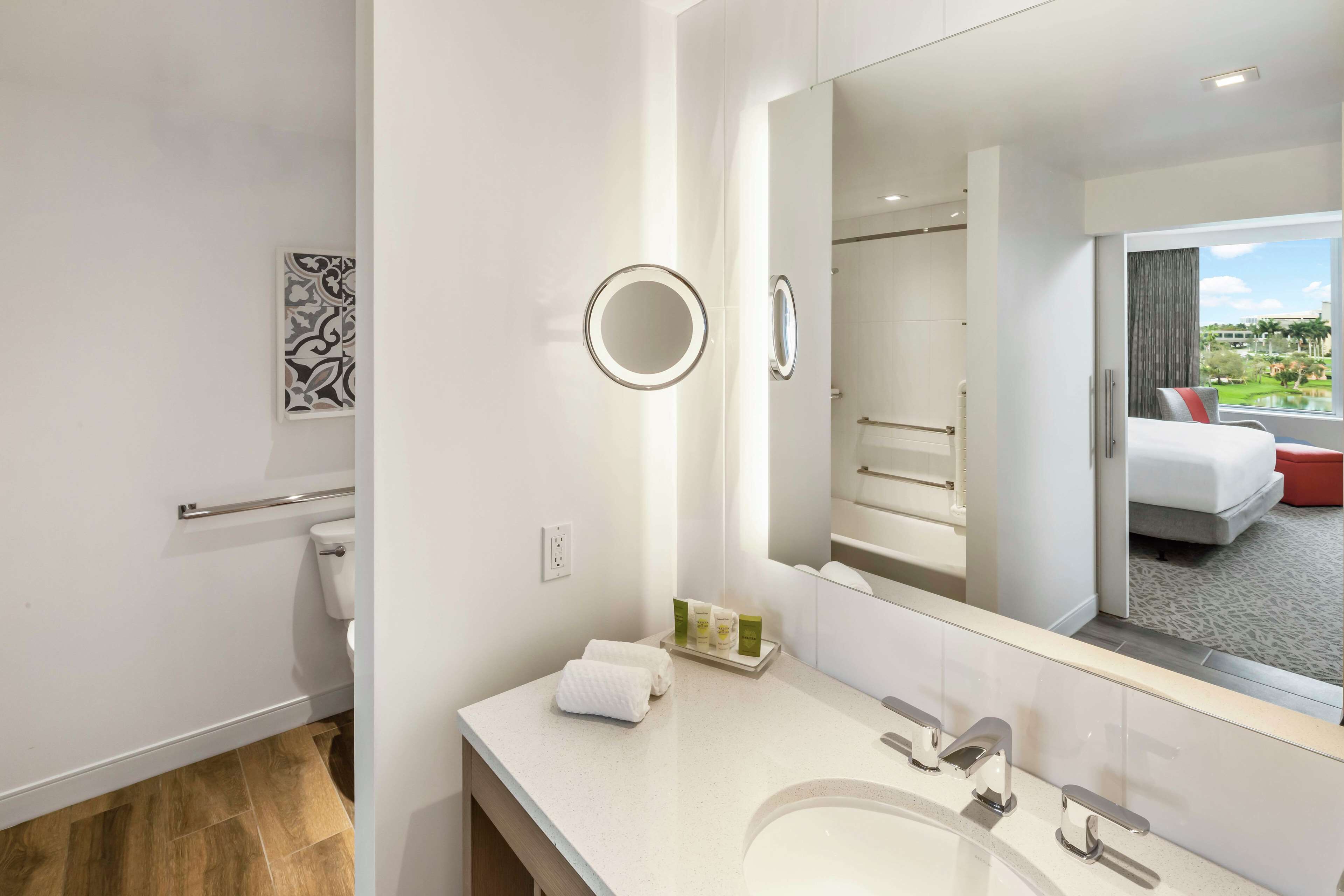 rainfall showerhead, designer toiletries, hair dryer, towels