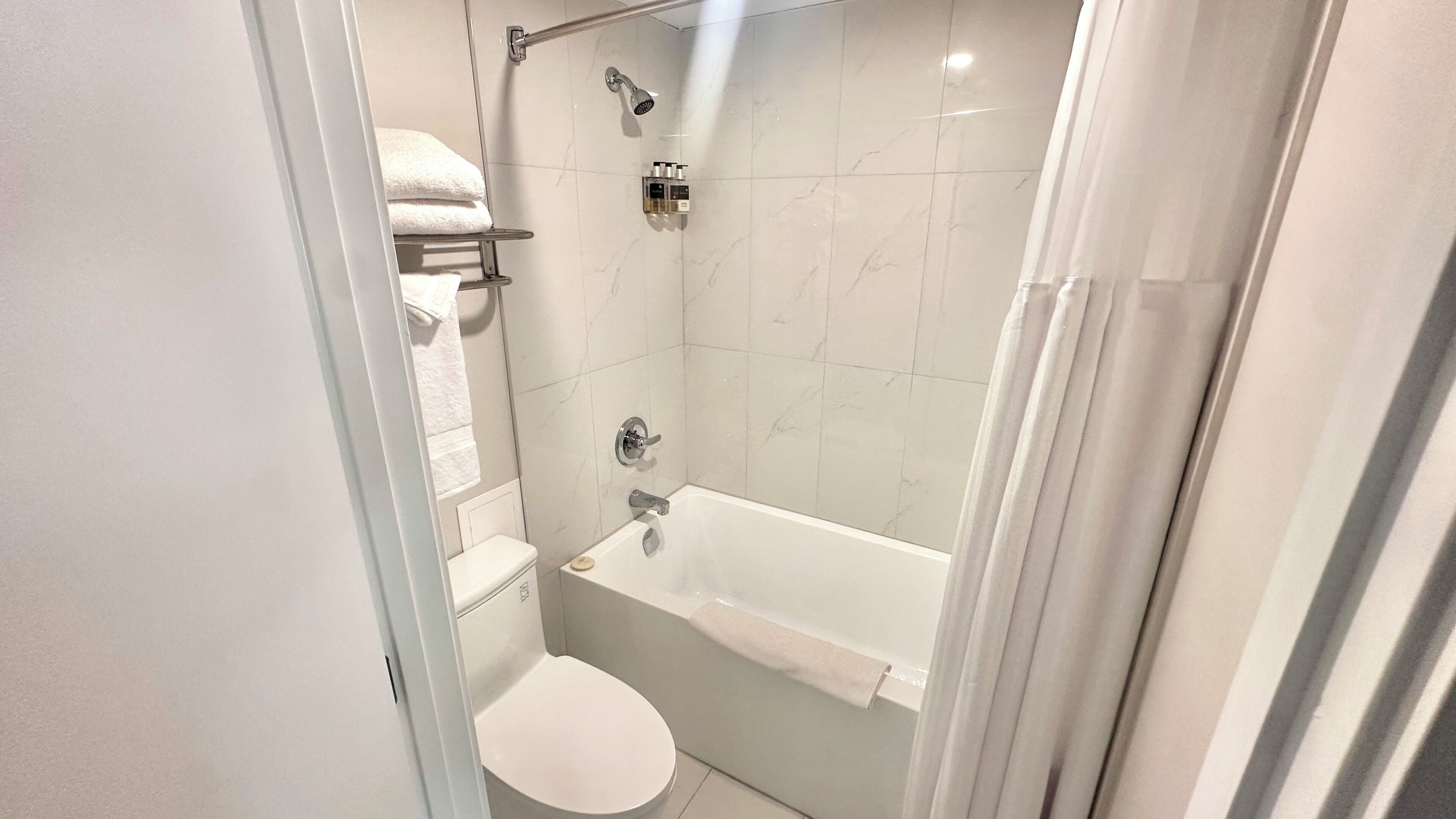 Room, 1 Queen Bed | Bathroom | Combined shower/tub, rainfall showerhead, free toiletries, hair dryer