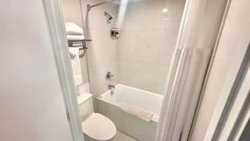 Room, 1 Queen Bed | Bathroom | Combined shower/tub, rainfall showerhead, free toiletries, hair dryer