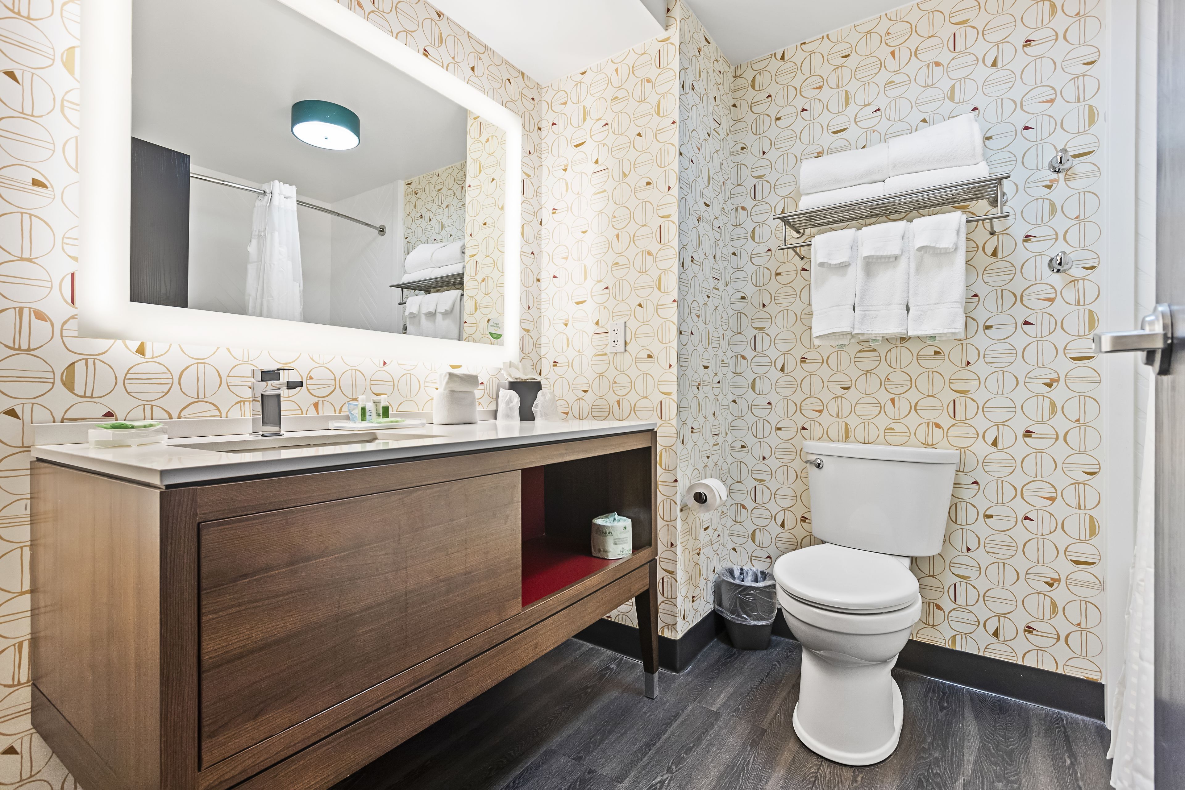 designer toiletries, hair dryer, towels, soap