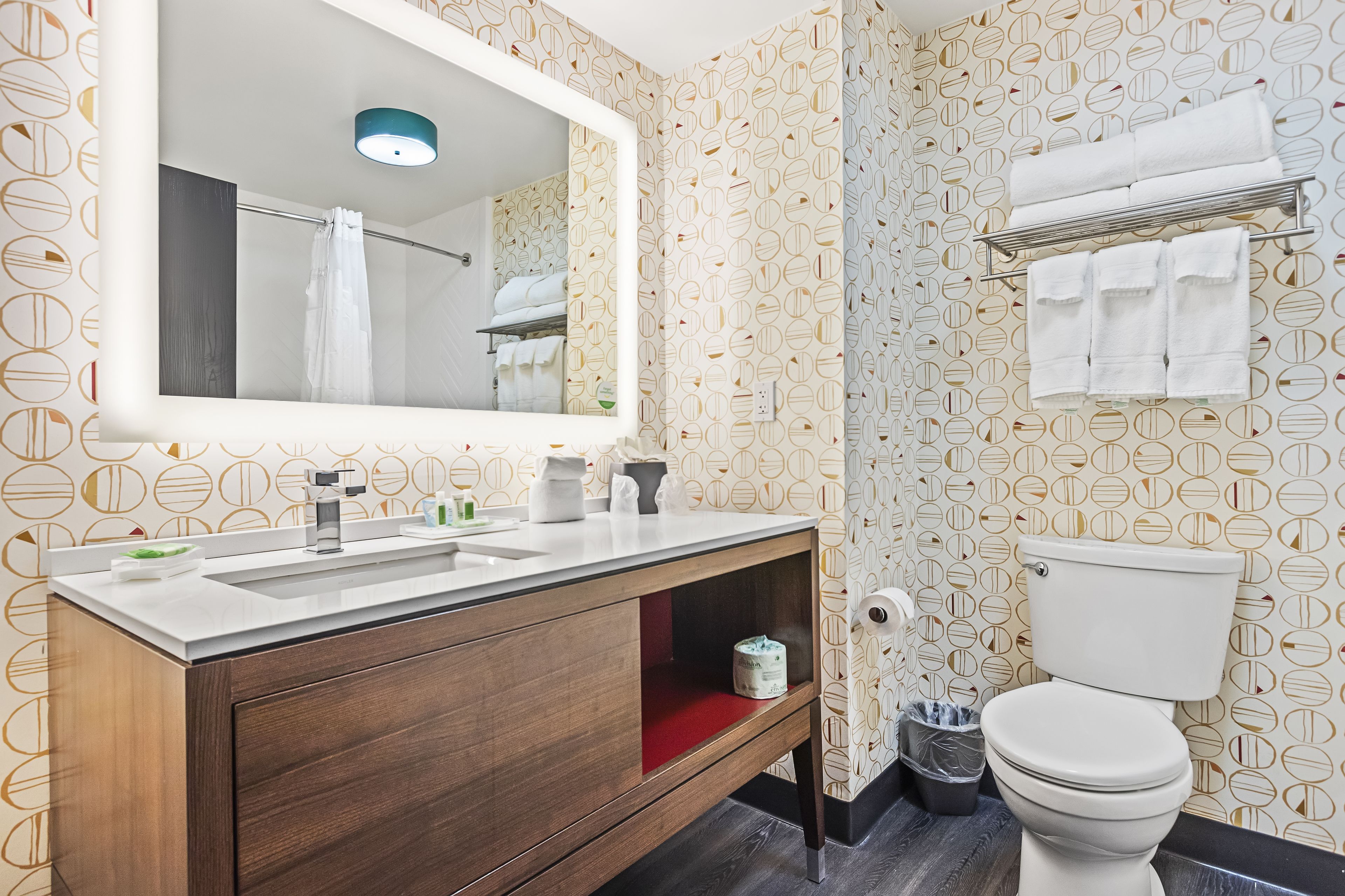 designer toiletries, hair dryer, towels, soap