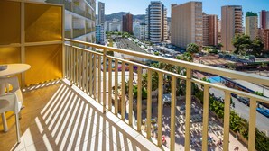 A balcony with a view of a cityscape, including tall buildings and a street below. - Hotel Servigroup Orange (Benidorm)