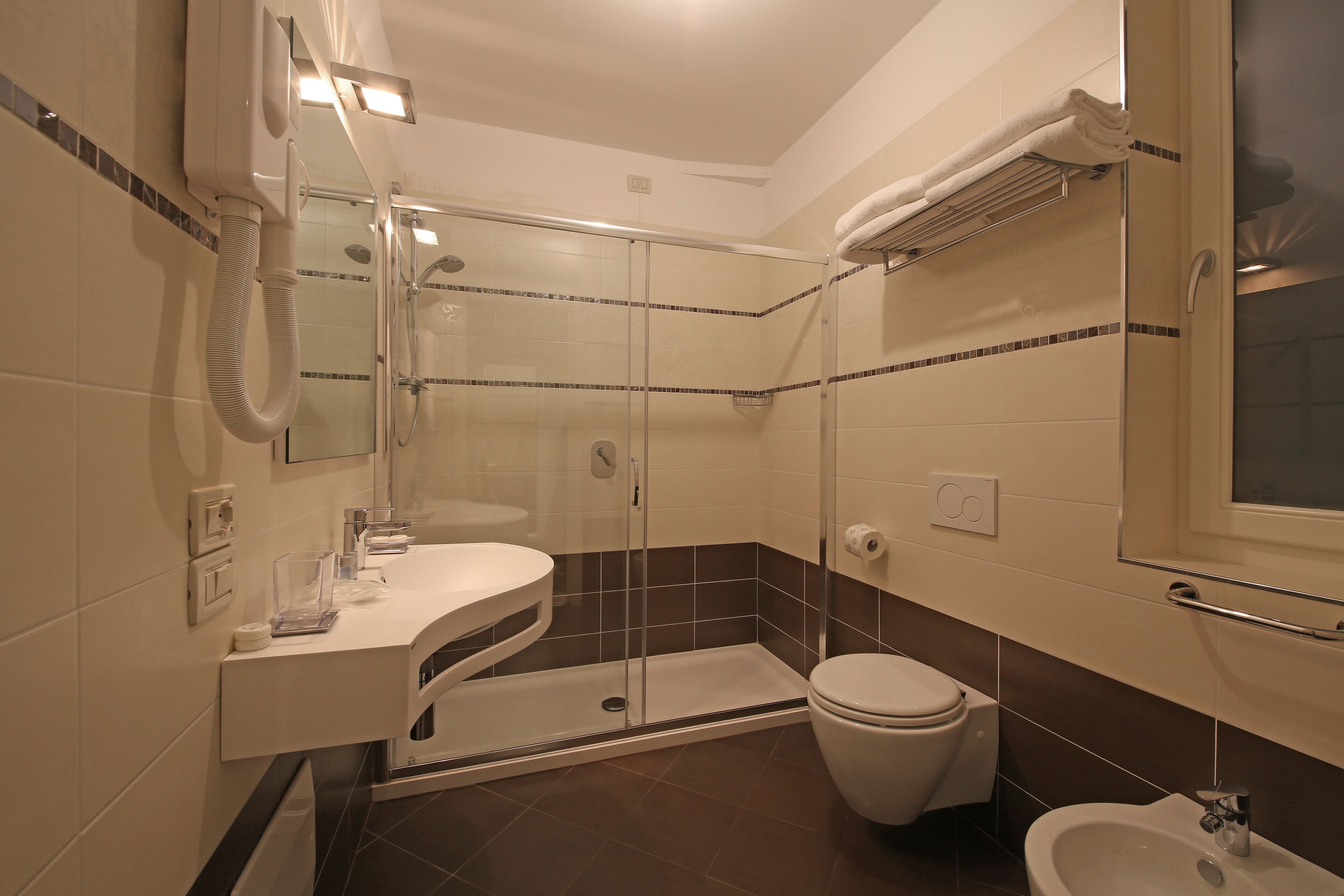 superior triple room | bathroom | rainfall showerhead, free toiletries, hair dryer, bidet