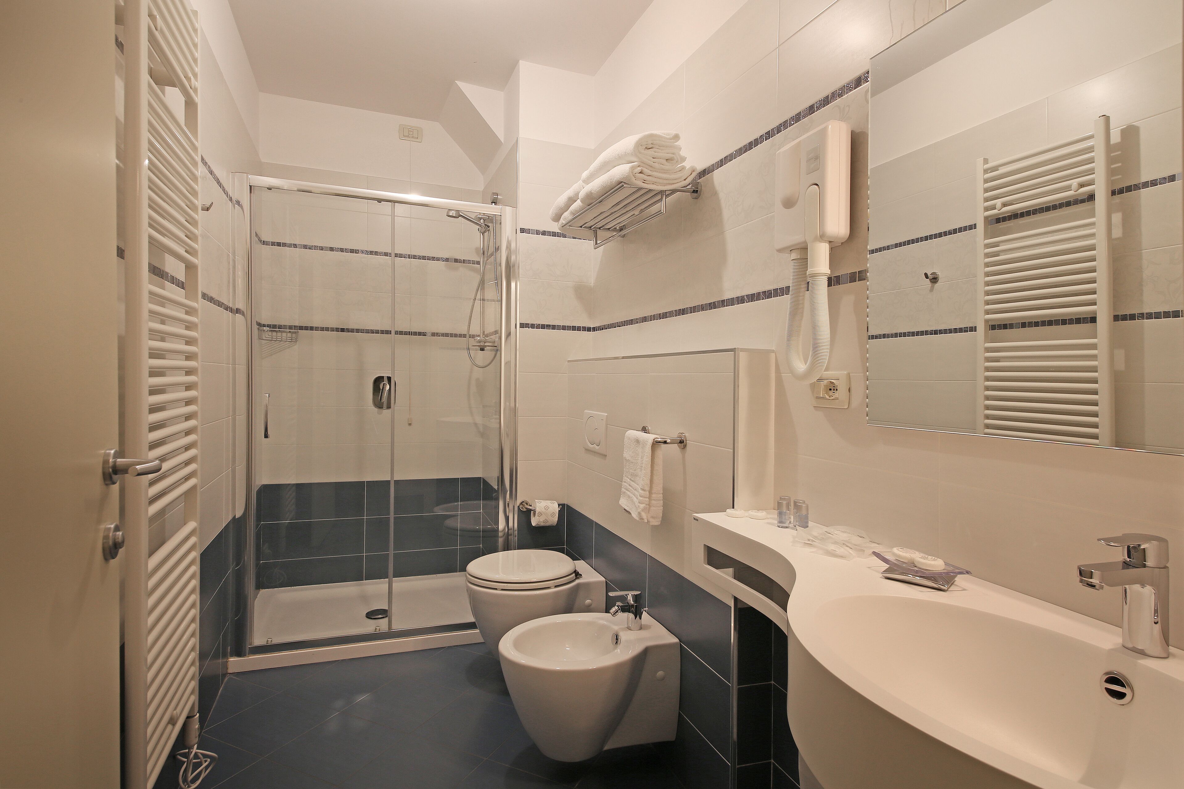 superior triple room | bathroom | rainfall showerhead, free toiletries, hair dryer, bidet