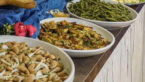 A buffet with various dishes including salads, beans, and skewers. - Hotel Dasamo - Dada Hotels (Rimini)