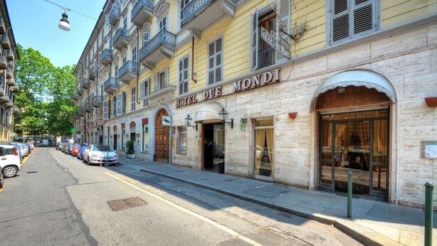 A hotel named "HOTEL DUE MONDI" with a classic facade, large windows, and a visible restaurant sign. - Hotel Due Mondi (Turin)