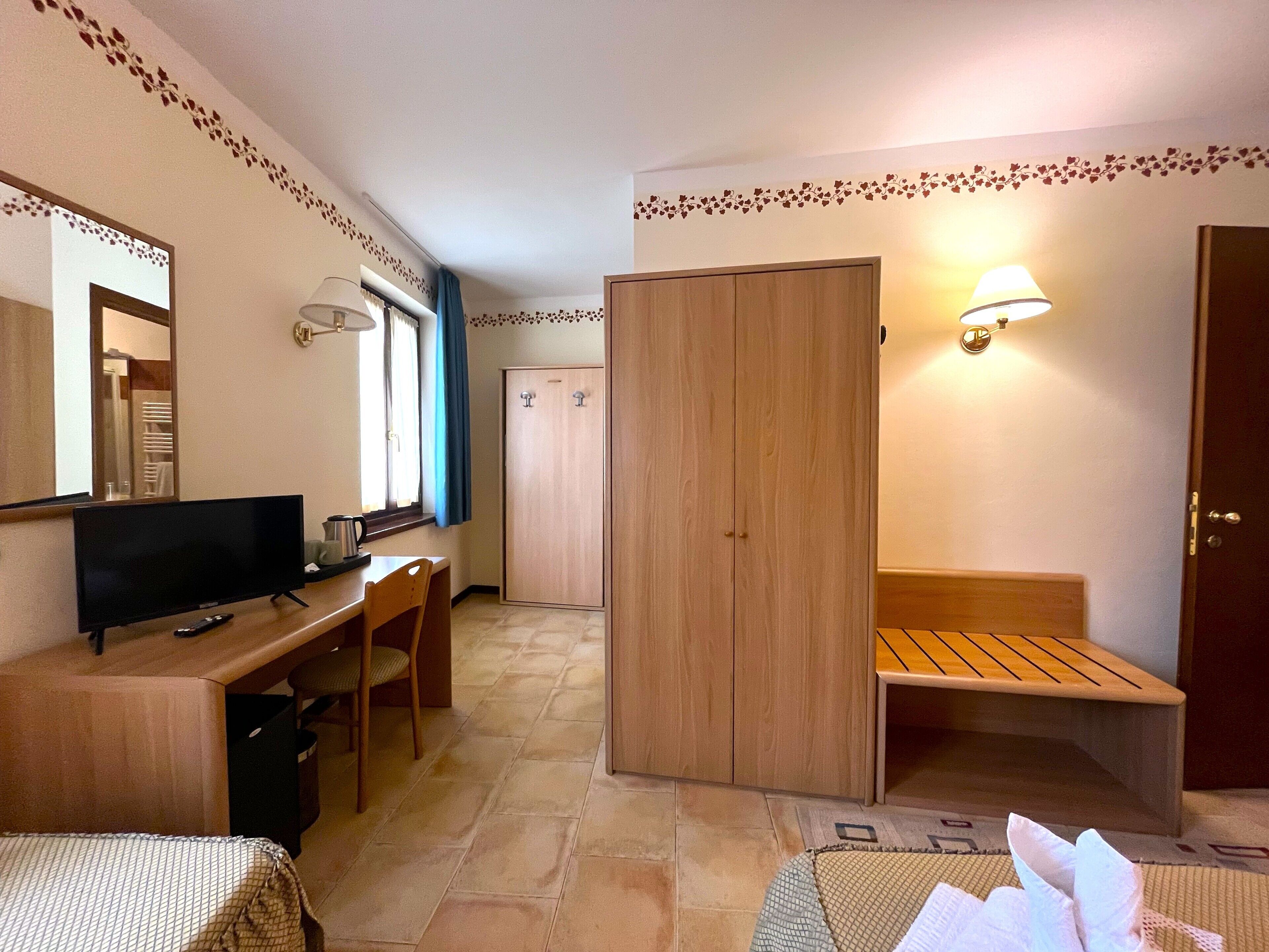 triple room | minibar, in-room safe, desk, blackout curtains