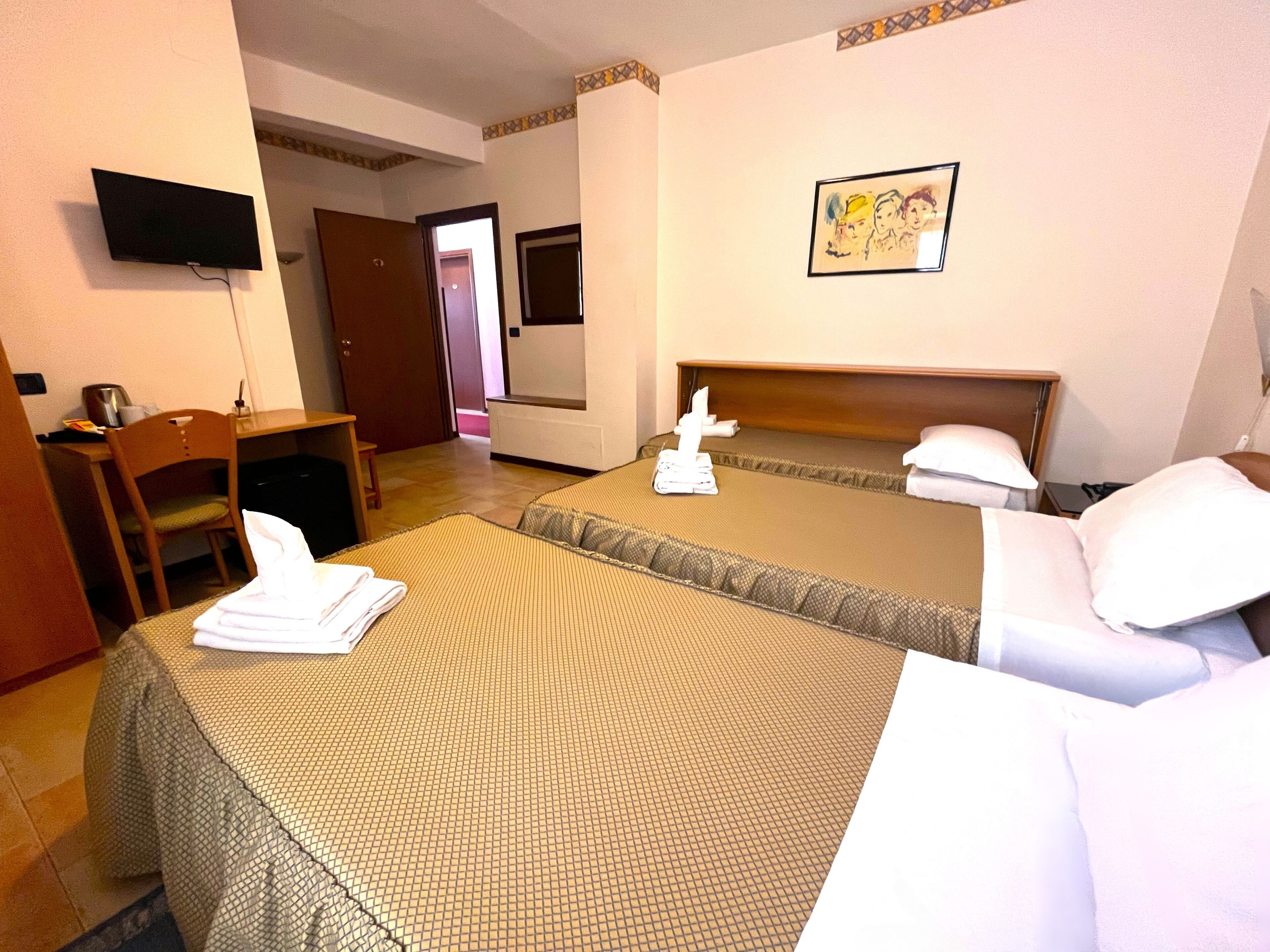 triple room | minibar, in-room safe, desk, blackout curtains