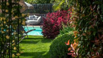 Indoor pool, seasonal outdoor pool, pool umbrellas, pool loungers