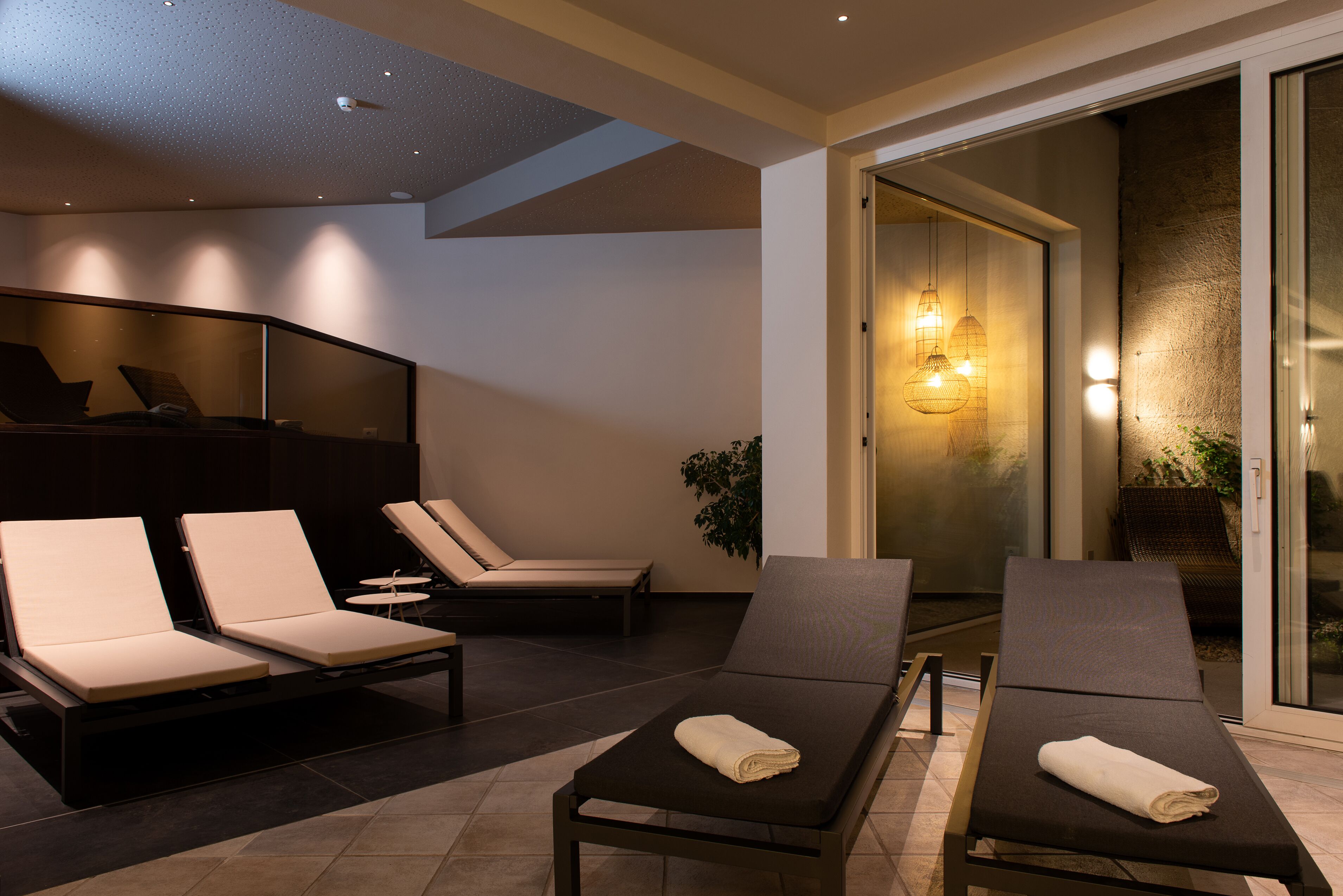 indoor pool, seasonal outdoor pool, pool umbrellas, pool loungers