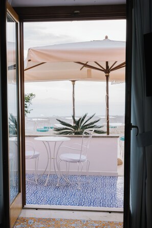 Deluxe Triple Room, 1 Bedroom, Sea View | Memory-foam beds, minibar, in-room safe, individually decorated
