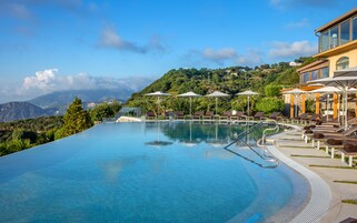 Outdoor pool, open 9:00 AM to 7:00 PM, pool umbrellas, sun loungers