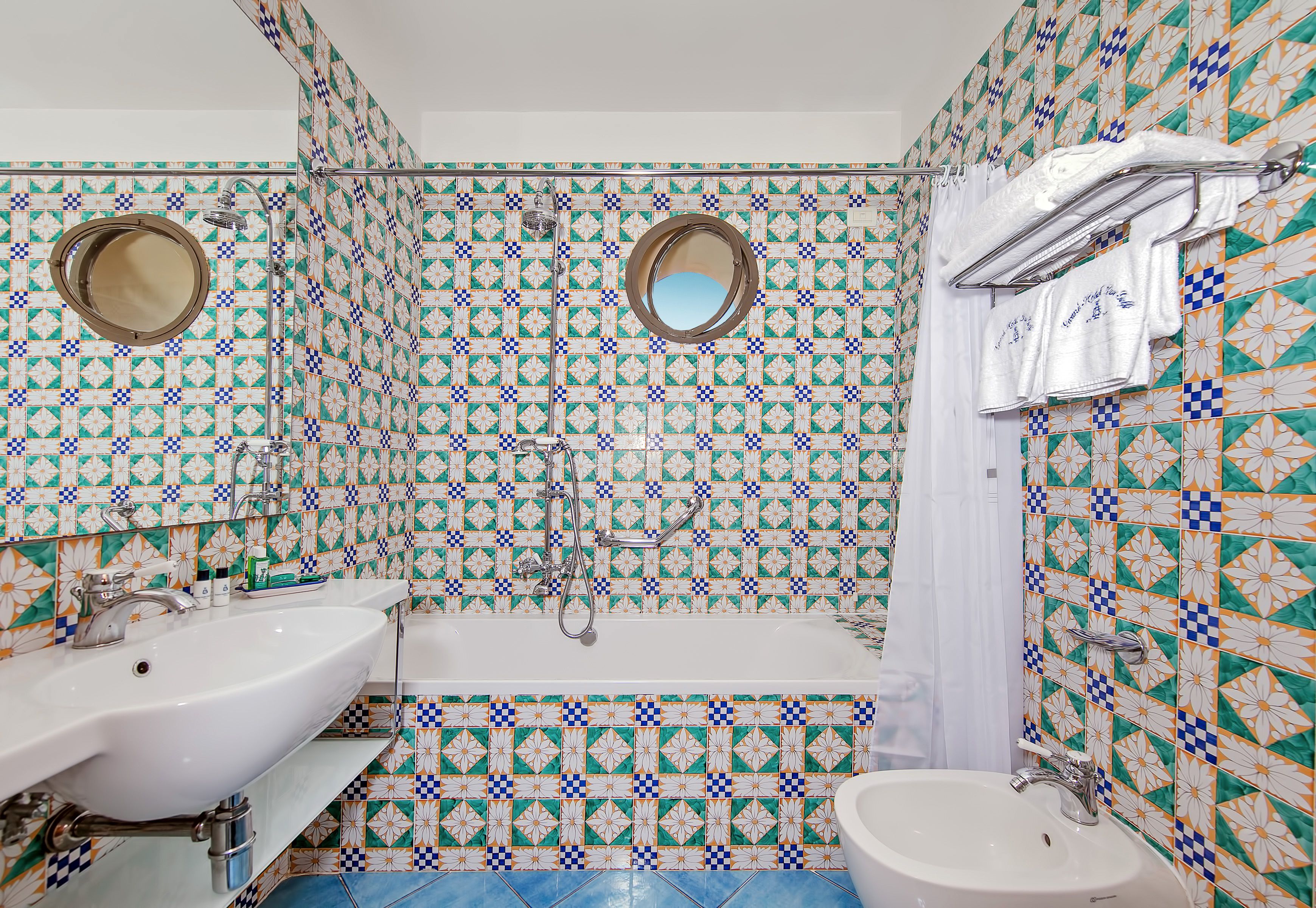 rainfall showerhead, hair dryer, bidet, towels