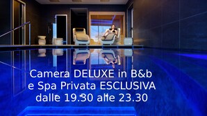 A modern spa area with a pool, lounge chairs, and a person relaxing. - Albergo Moderno (Fuipiano Valle Imagna)