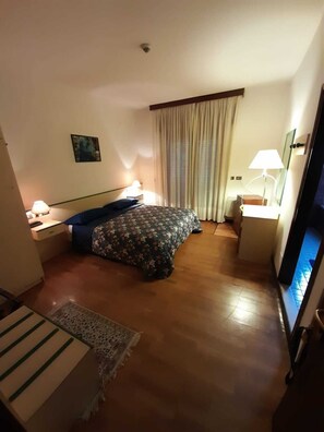 Premium bedding, down duvets, in-room safe, desk