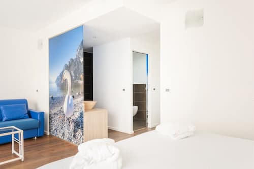 Deluxe Quadruple Room | Down duvets, in-room safe, individually decorated, desk