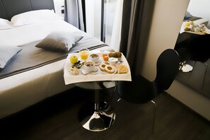 Premium bedding, down duvets, minibar, desk