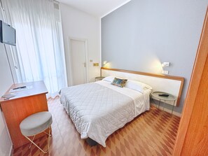 Habitación estándar con 1 cama matrimonial o 2 individuales | Ropa de cama de alta calidad y edredón