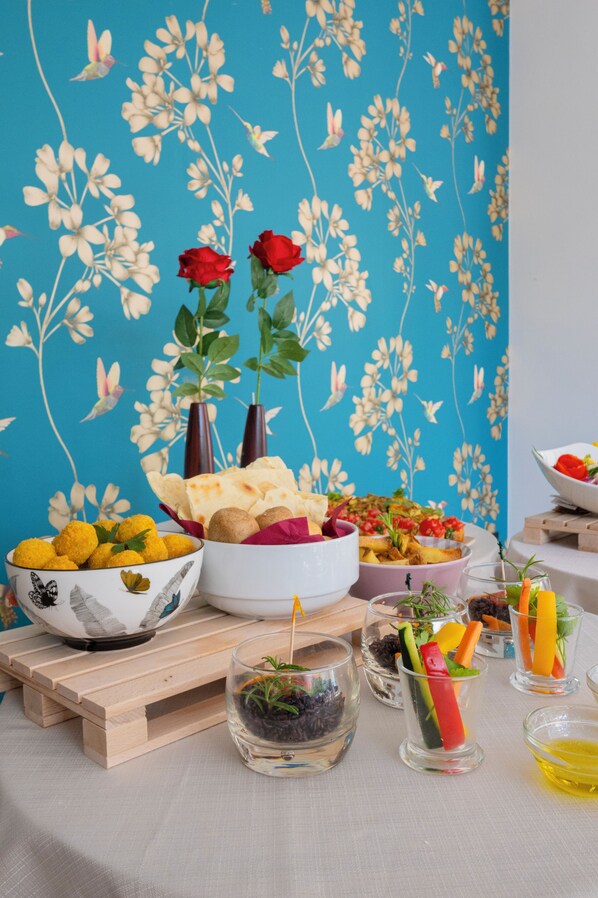 A table with various food items and decorative elements.