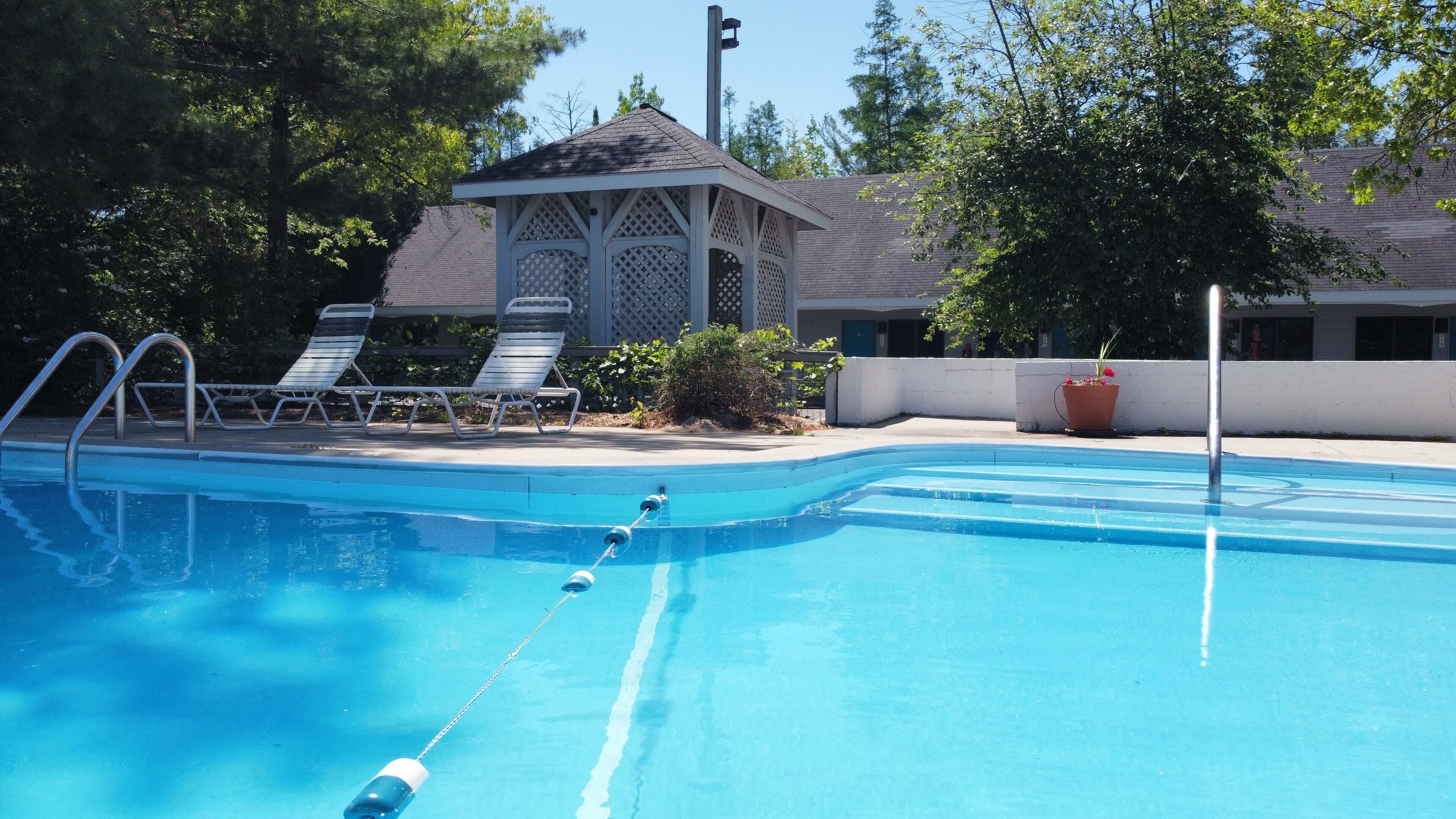 seasonal outdoor pool, pool umbrellas, pool loungers