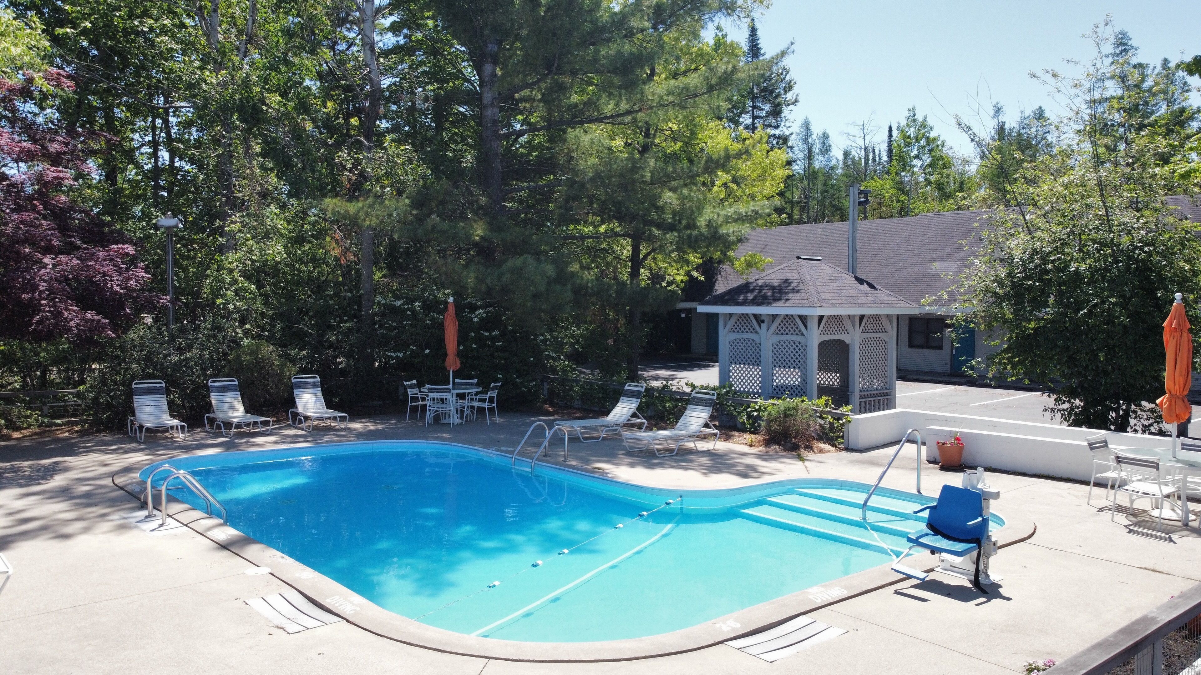 seasonal outdoor pool, pool umbrellas, pool loungers