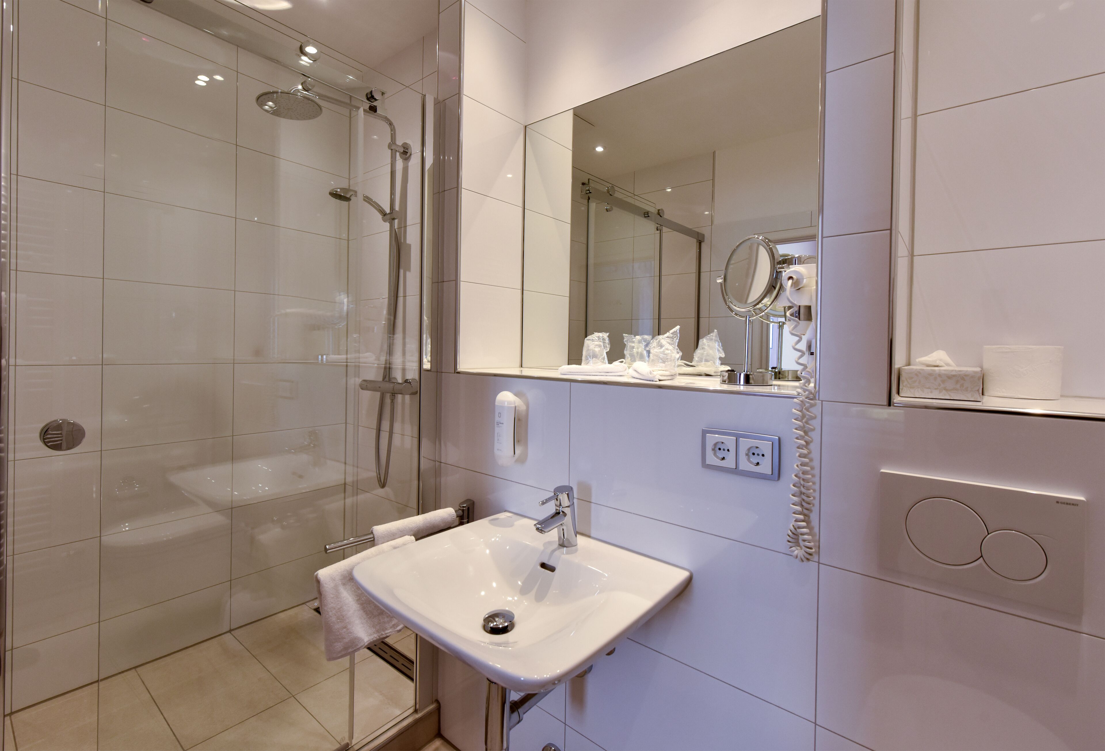 free toiletries, hair dryer, slippers, towels