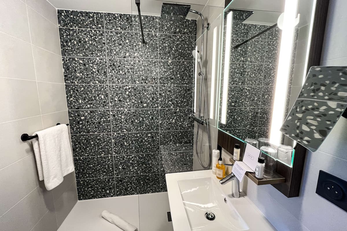 bathtub, free toiletries, hair dryer, towels