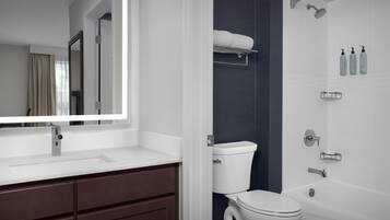Combined shower/bathtub, designer toiletries, hair dryer, towels