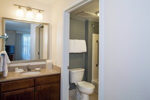 Combined shower/bathtub, designer toiletries, hair dryer, towels