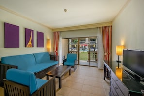 Premium Suite, 1 Bedroom, Pool View (King) | Minibar, in-room safe, desk, blackout curtains