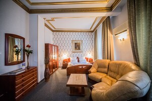 Deluxe Suite | Living area | 110-cm Smart TV with cable channels, TV