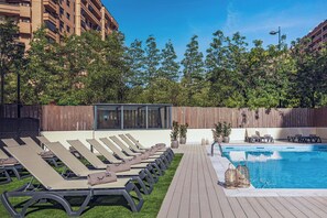 Outdoor pool, open 10 AM to 8:30 PM, pool umbrellas, pool loungers