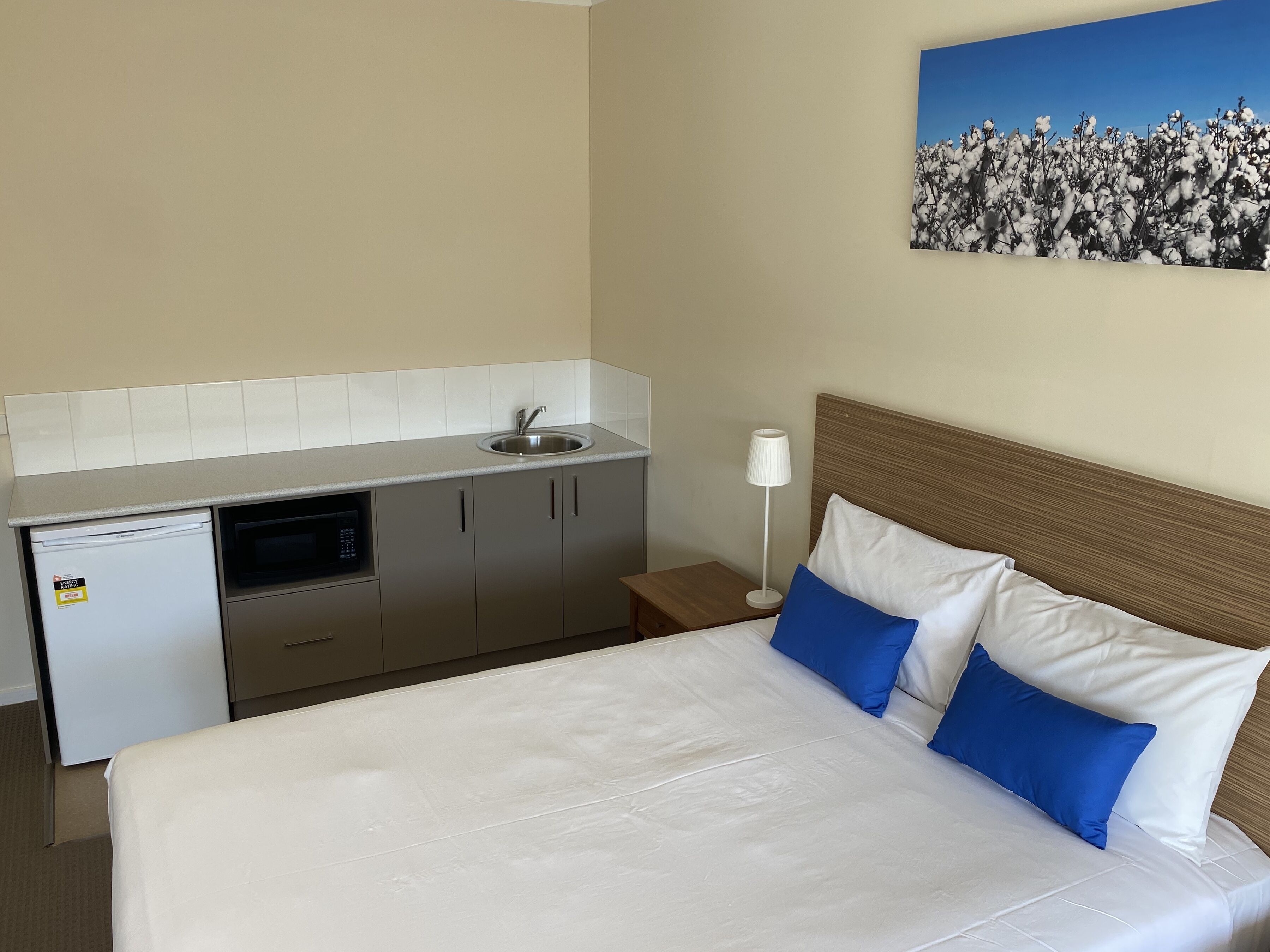 Desk, laptop workspace, blackout drapes, iron/ironing board