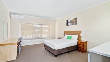 Standard Room, Non Smoking (1 Queen & 3 Single Beds) | Desk, laptop workspace, blackout curtains, iron/ironing board
