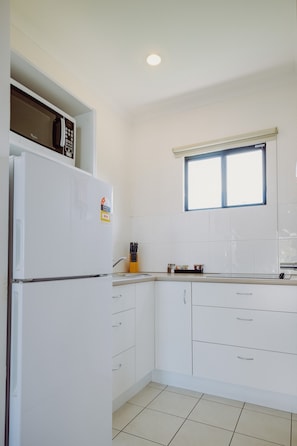 Microwave, electric kettle, toaster, cleaning supplies