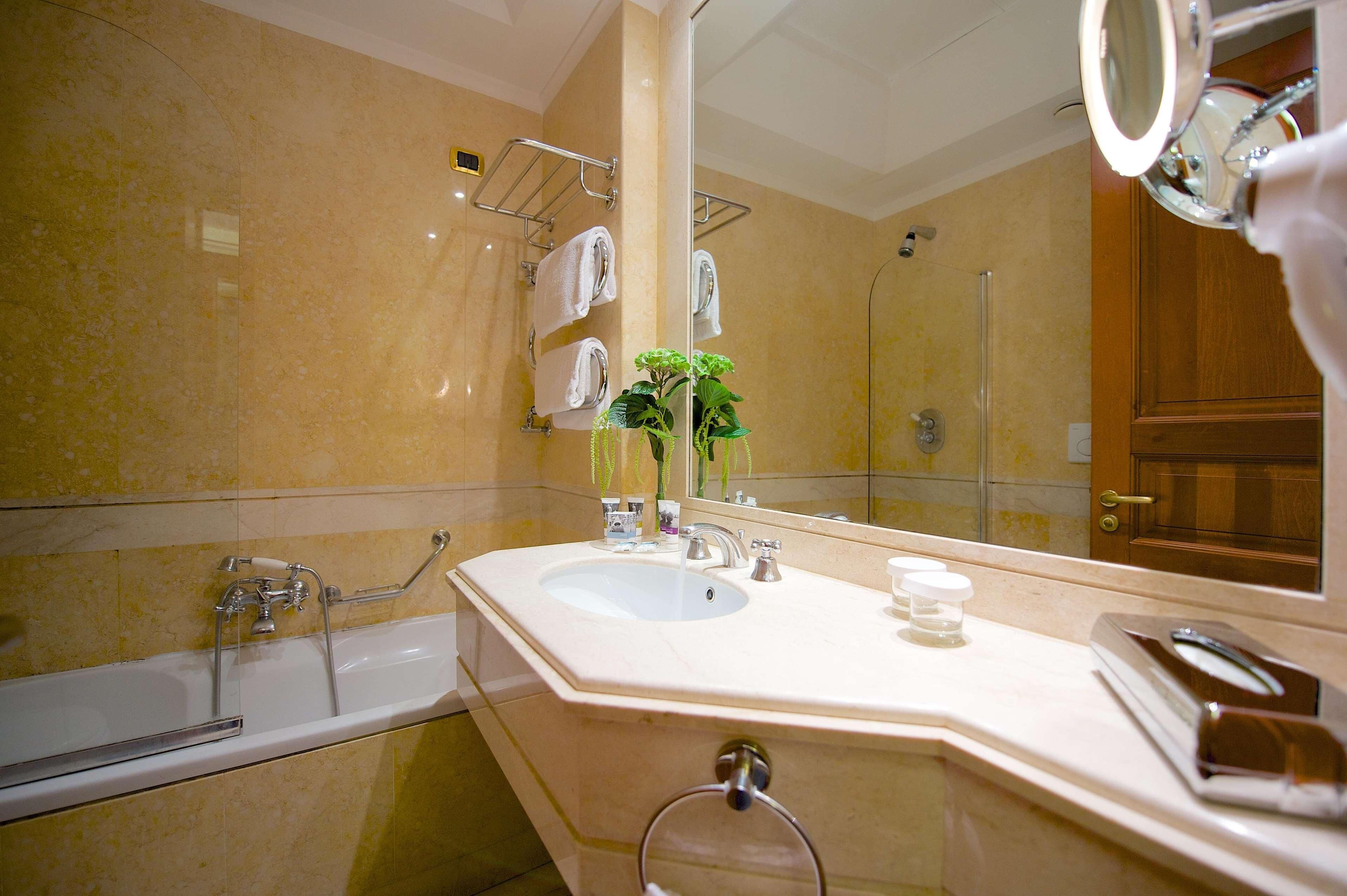 deep-soaking bathtub, rainfall showerhead, free toiletries, hair dryer