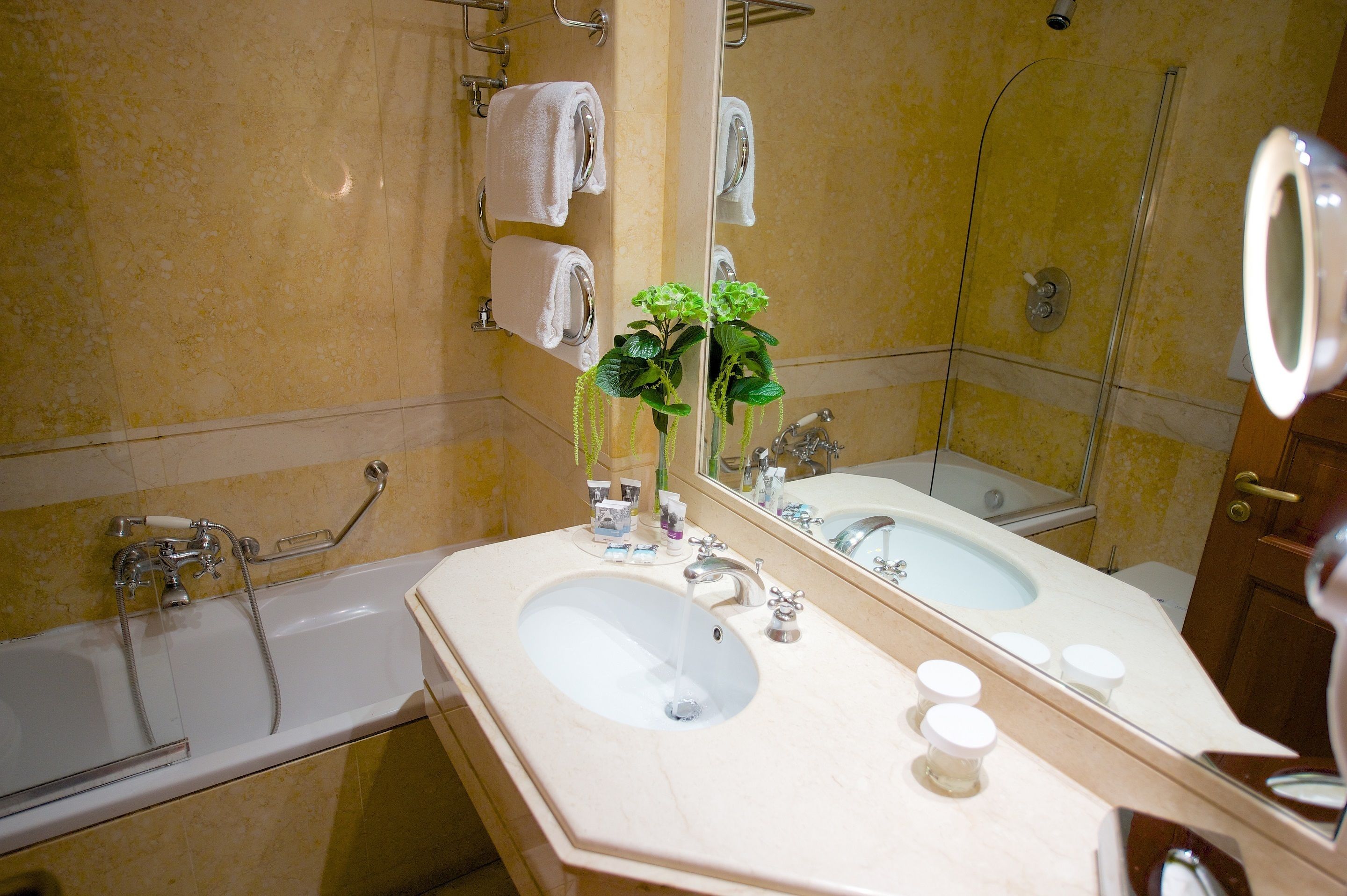 deluxe double room | bathroom | deep-soaking bathtub, rainfall showerhead, free toiletries, hair dryer