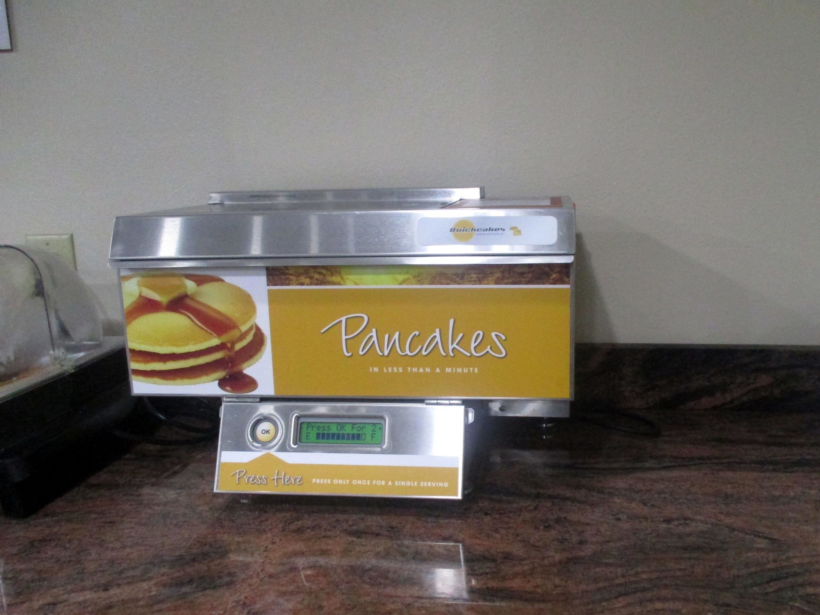 A pancake maker with a 'Pancakes' label and a digital display.