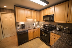 Full-sized fridge, microwave, stovetop, dishwasher