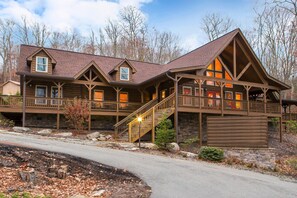 A large log cabin with multiple balconies and a stone foundation. - Bluegreen Vacations Blue Ridge Village, an Ascend Collection Resort (Banner Elk)