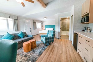 Deluxe Suite, 1 King Bed with Sofa bed, Fireplace (No Pets) | 2 bedrooms, pillowtop beds, desk, iron/ironing board
