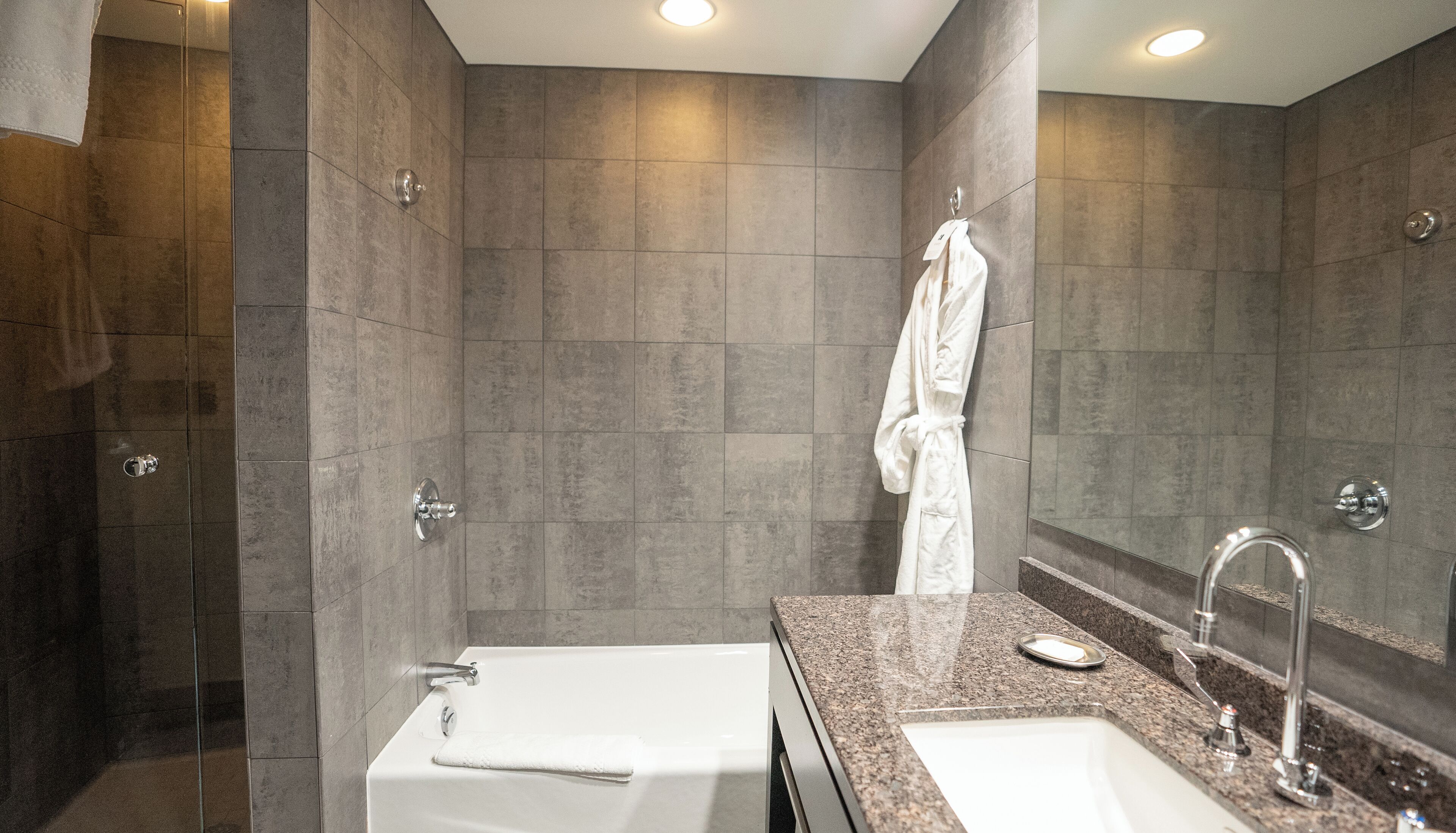 junior suite | bathroom | shower, designer toiletries, hair dryer, bathrobes