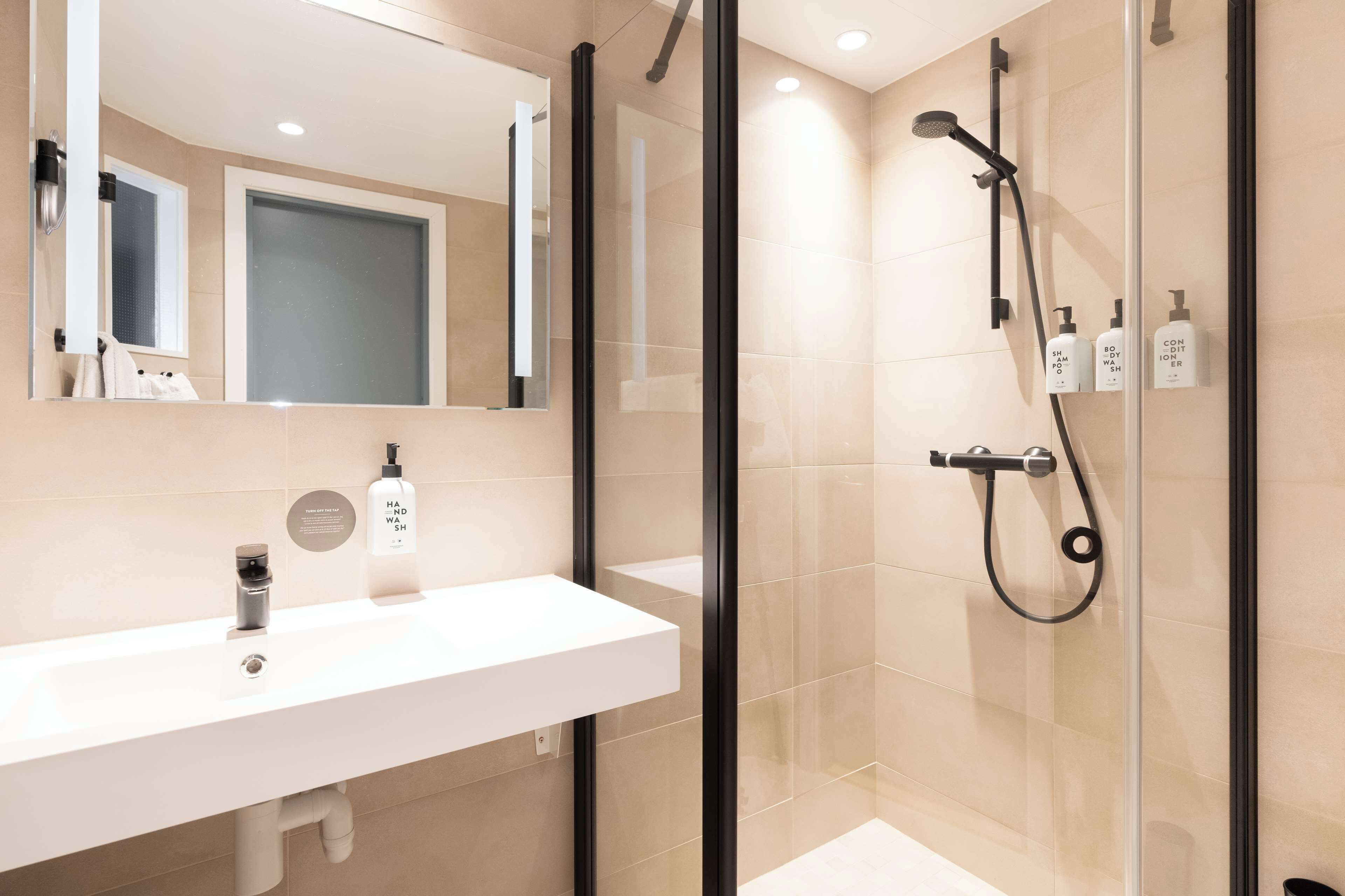 room, 1 queen bed | bathroom | hair dryer, towels, soap, shampoo