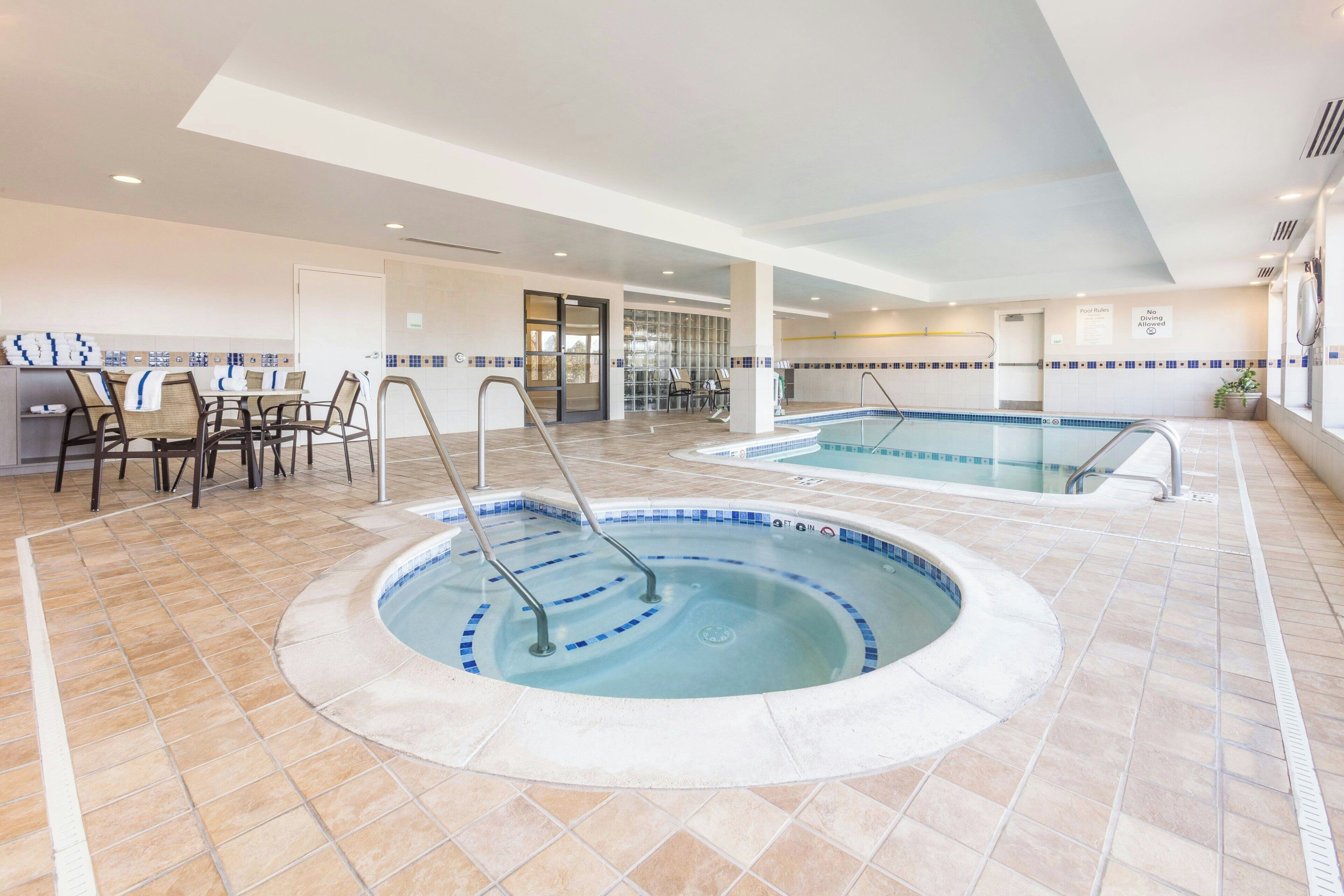 Indoor pool, open 6:00 AM to 11:00 PM, pool loungers