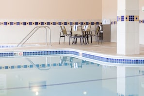 Indoor pool, open 6:00 AM to 11:00 PM, pool loungers