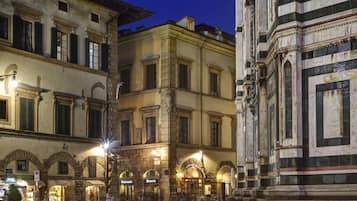 Explore historic architecture and vibrant commercial activity in this charming urban square.