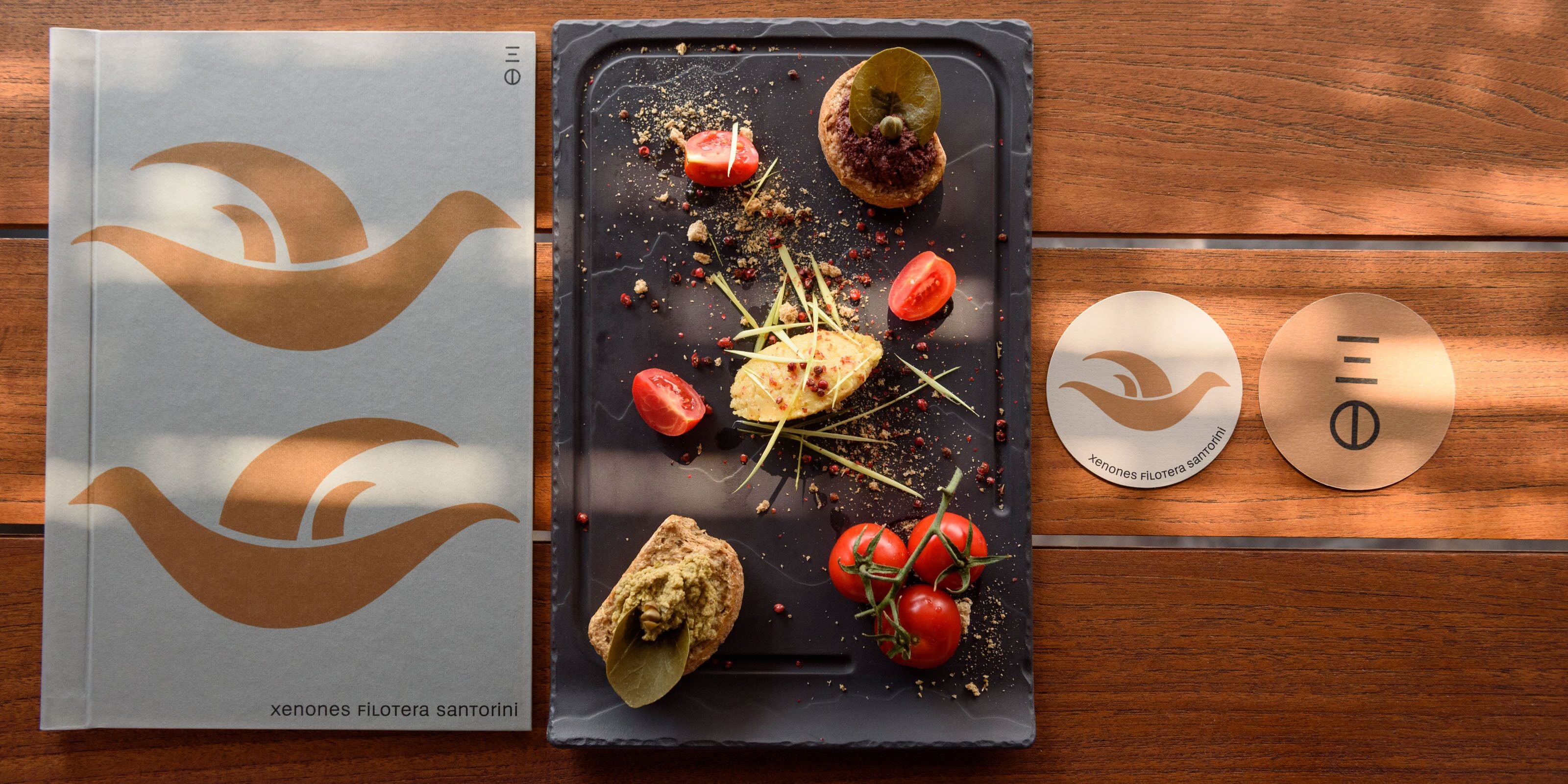 A tray with food items on a wooden table.