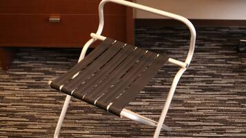 A chair with a metal frame and a dark seat.