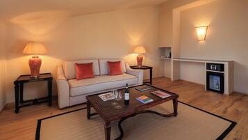 Superior Suite, Hill View | Living area | 24-inch TV with satellite channels