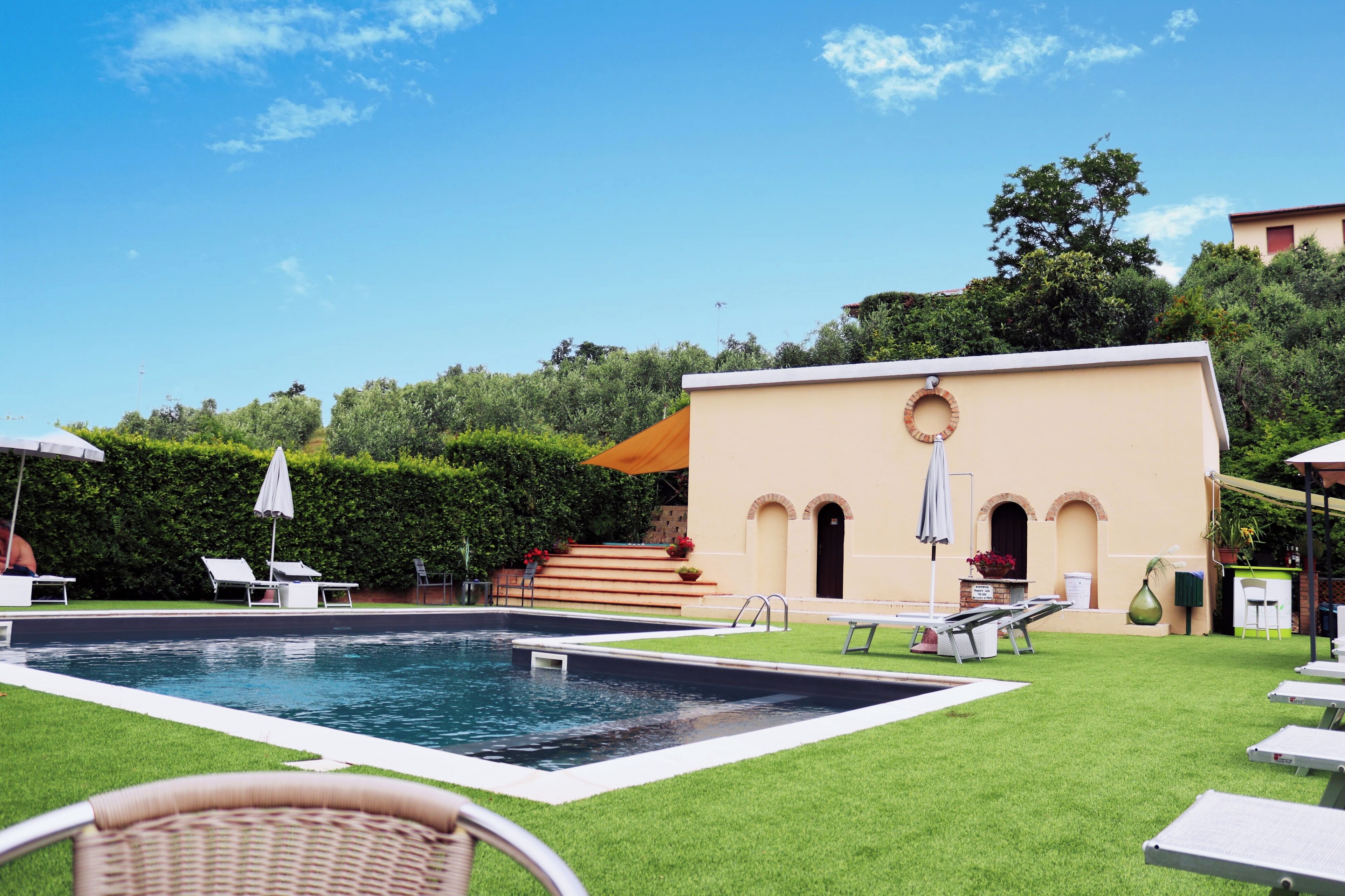 seasonal outdoor pool, open 8 am to 8:00 pm, pool umbrellas